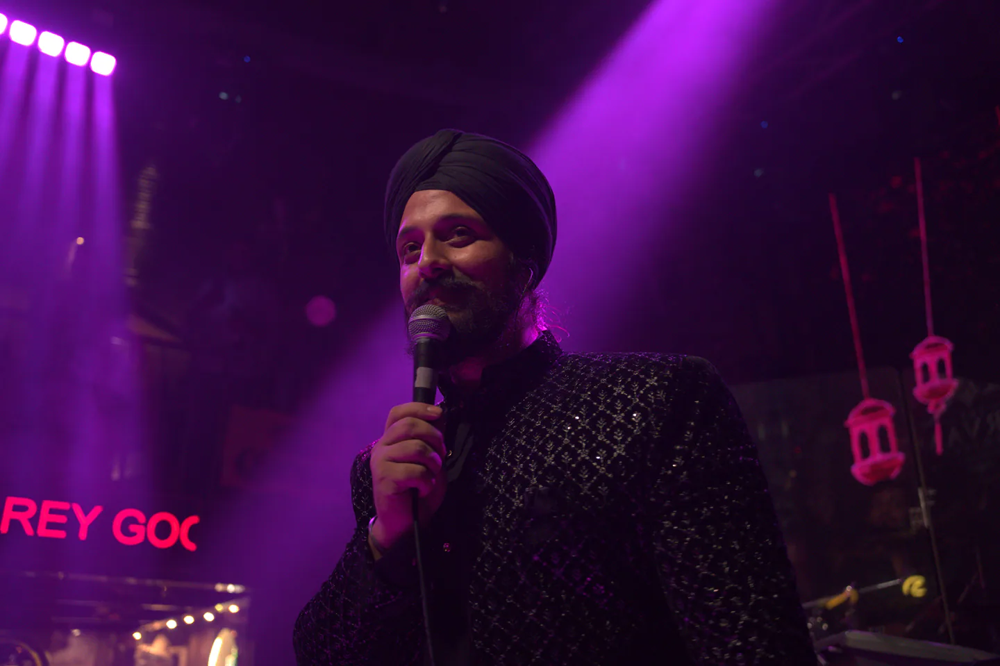 The Karvaan Project singer performing live under purple stage lights